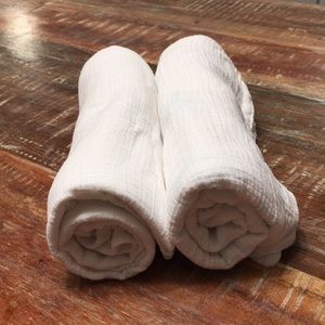 Two Aden + Anais swaddle nursing blankets